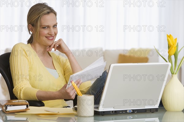 Woman paying bills.