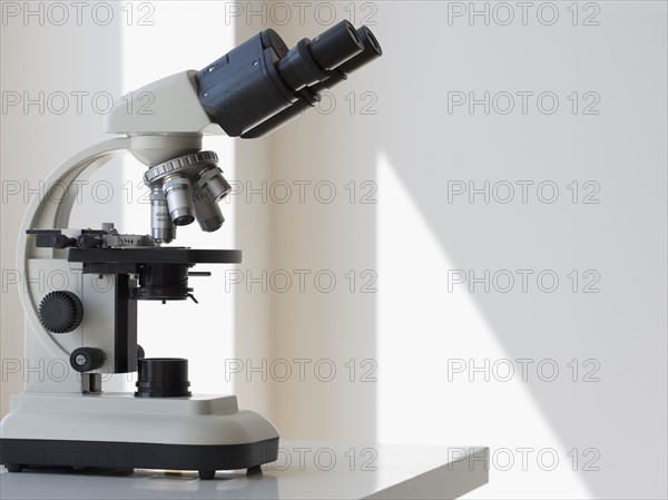 Microscope on table.