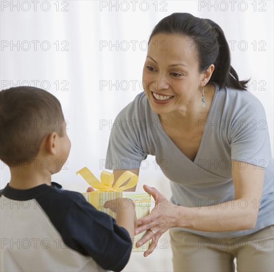 Asian mother receiving gift from son.