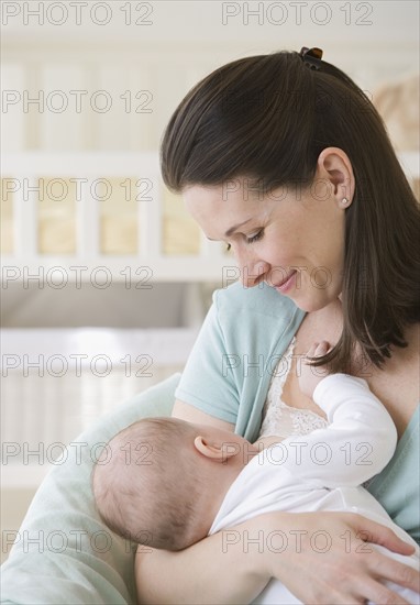 Mother breastfeeding baby.