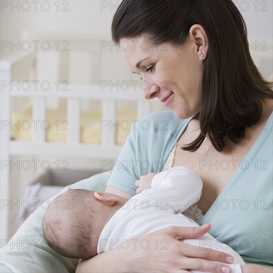 Mother breastfeeding baby.