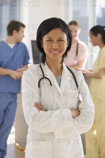 Portrait of female doctor with arms crossed.