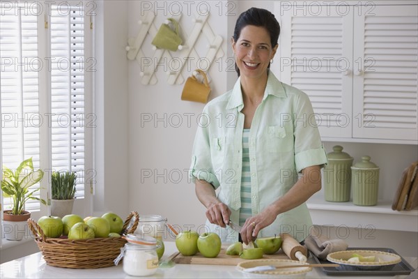 Woman making apple pie.