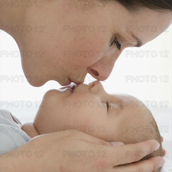 Mother kissing bay.