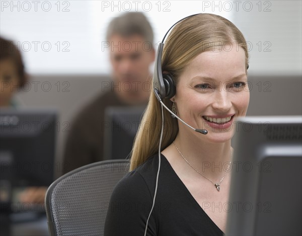 Businesswoman wearing headset.