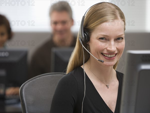 Businesswoman wearing headset.