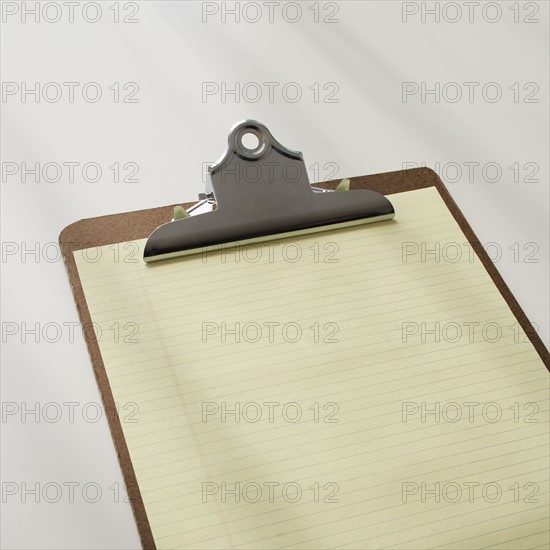 Clipboard with blank paper.