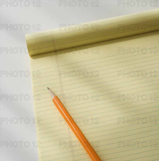 Close up of notepad and pencil.