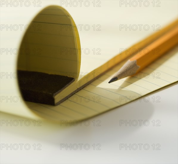 Close up of notepad and pencil.