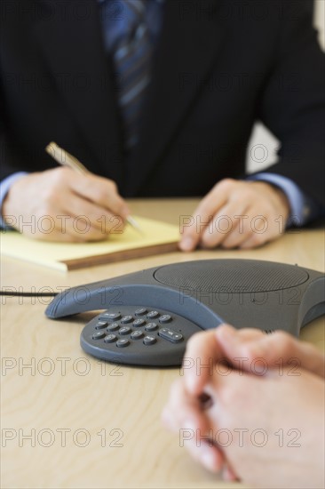 Businesspeople having teleconference.