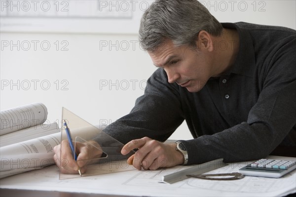 Male architect working at desk.