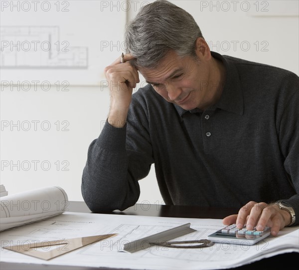 Male architect working at desk.
