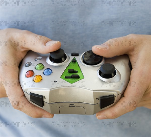 Man holding video game controller.