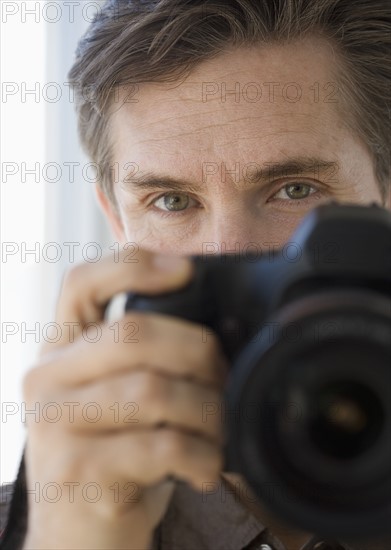 Man holding up camera.