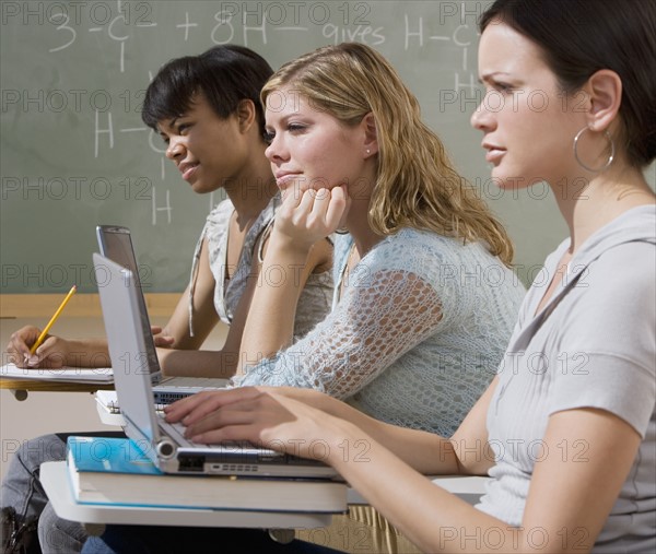 Multi-ethnic women in classroom.