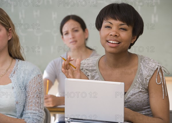 Ethnic-ethnic women in classroom.