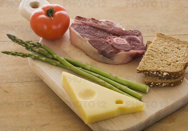 Assorted food groups on cutting board.