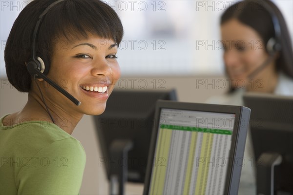 African businesswoman wearing headset.