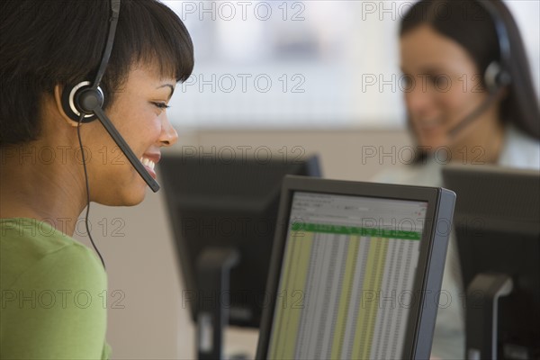 African businesswoman wearing headset.