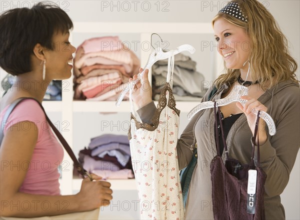 Two women at clothing store.