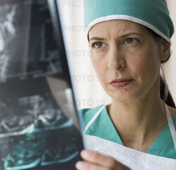 Female doctor looking at x-ray.