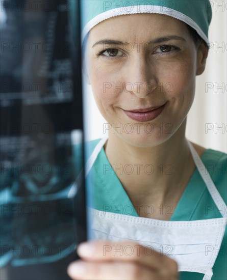 Female doctor holding x-ray.