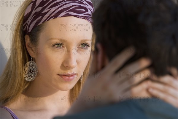 Woman looking at boyfriend.