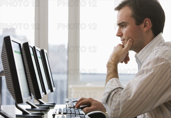 Businessman typing on computer.