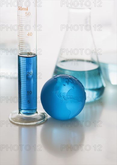 Close up of beakers with liquid.