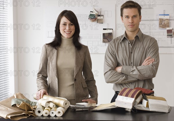 Portrait of interior designers at shop.