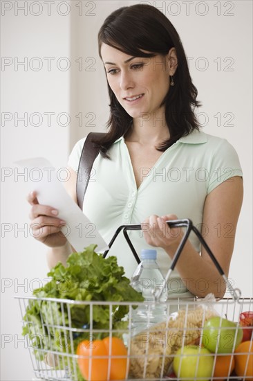 Woman grocery shopping.