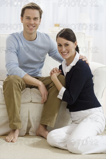 Portrait of couple in livingroom.