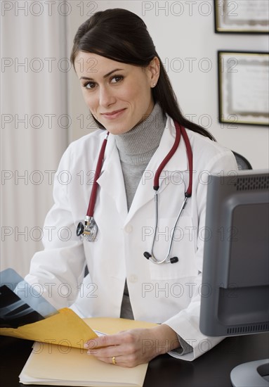 Portrait of female doctor in office.