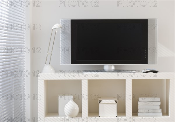 Flat screen television on shelf.