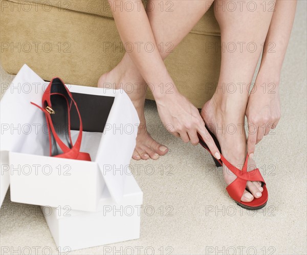 Close up of woman trying on shoes.