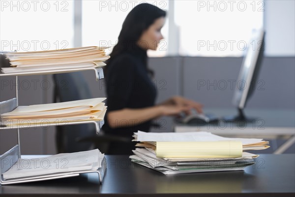 Businesswoman typing on computer.