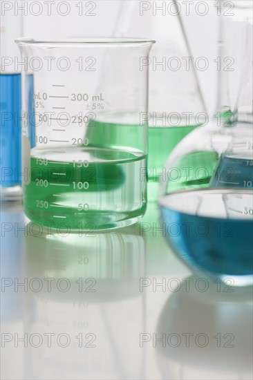 Close up of beakers with liquid.