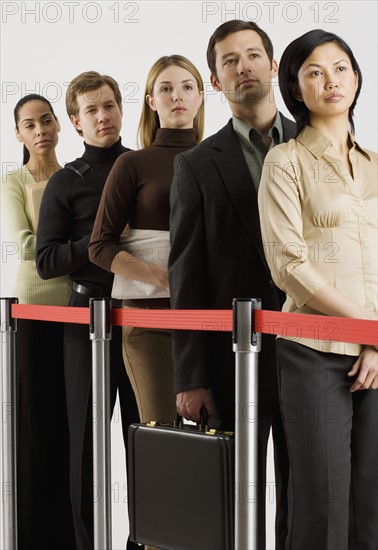 Group of people standing in line.