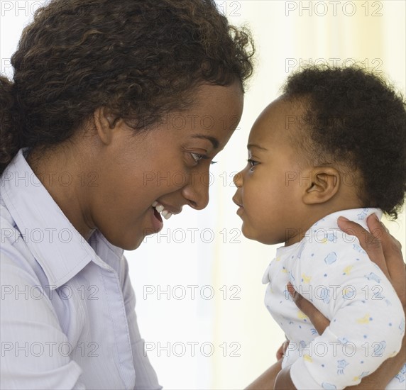 Mother smiling at baby.