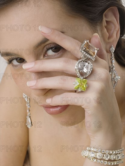 Portrait of woman wearing jewelry.