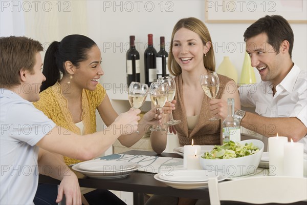 Two couple toasting with wine.