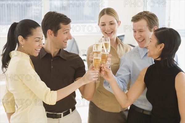 Businesspeople toasting with champagne.