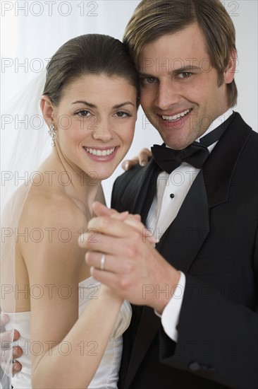 Bride and groom dancing.