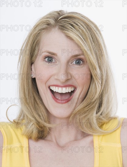 Close up of woman laughing.