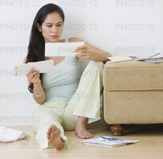 Woman paying bills.