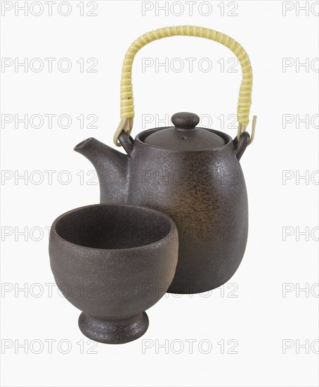 Close up of teapot and teacup.