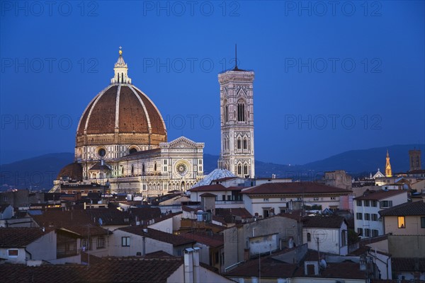 City rooftops and the Duomo Santa Maria Del Fiore, Florence, Italy.