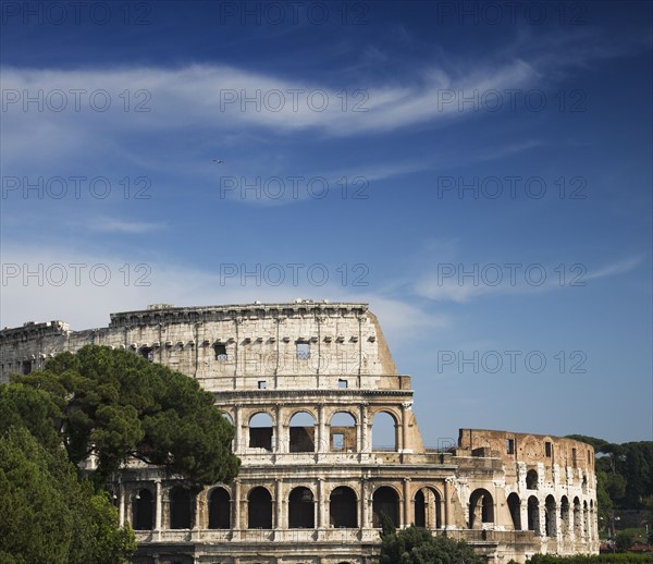 The Colosseum under blue sky, Italy.