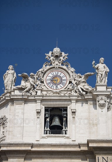 Clock on St. Peter’s Basilica, Italy.