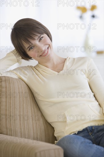 Woman sitting sofa.